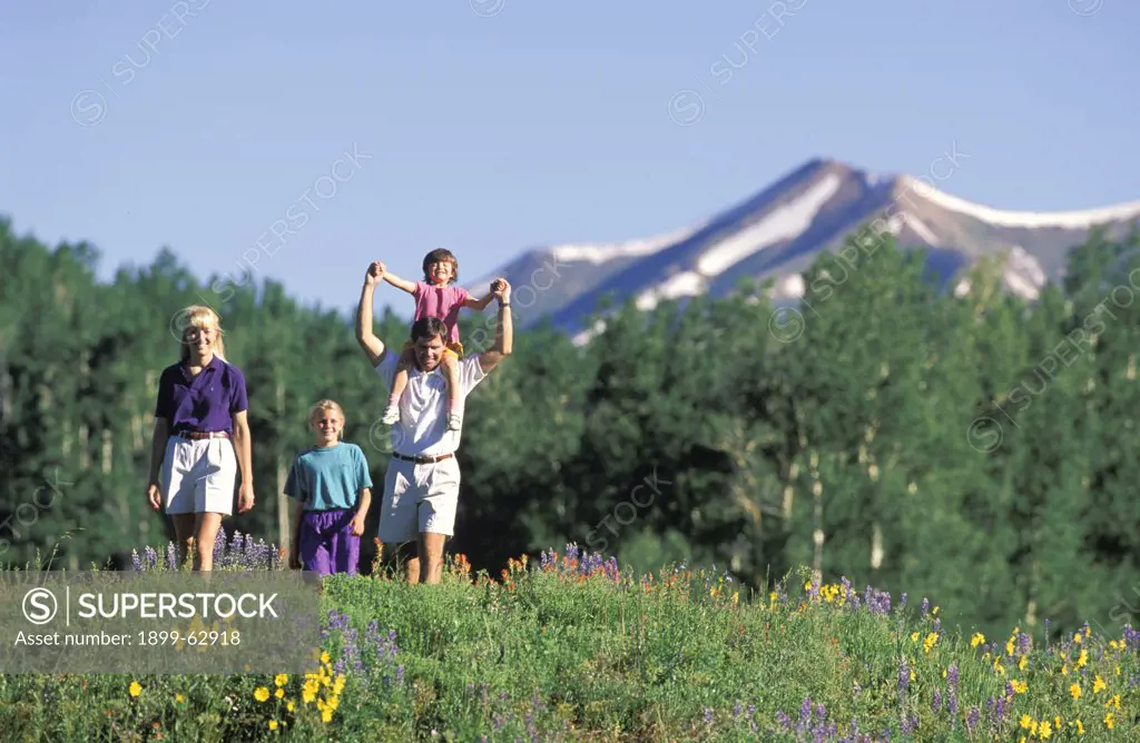 Colorado, Snodgrass Mountain . Family Mother, Father And Two Kids Hiking.
