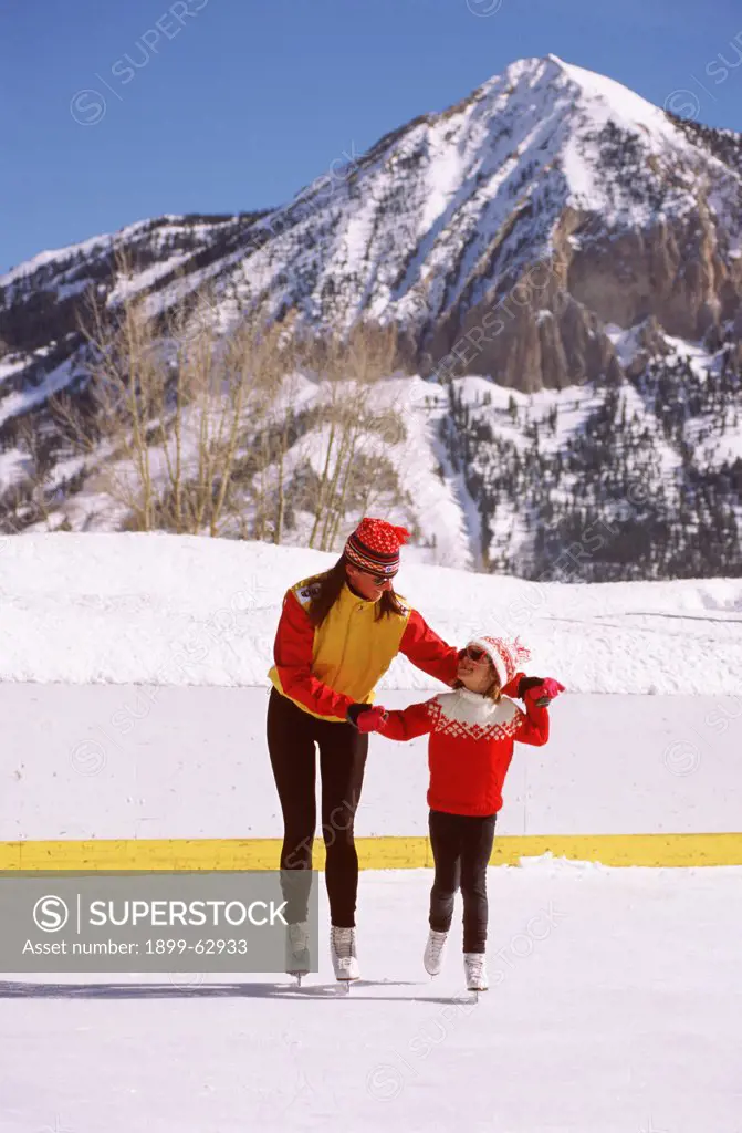 Colorado, Crested Butte. Mother And Daughter Ice Skating
