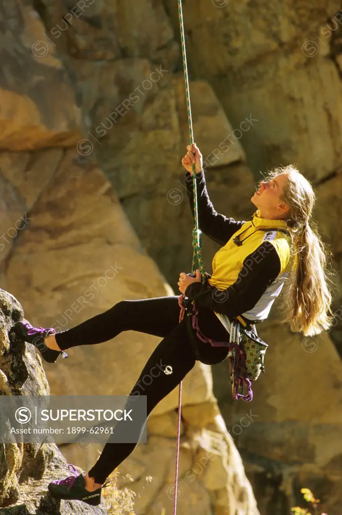 Colrado, Taylor Canyon. Woman Rock Climbing.