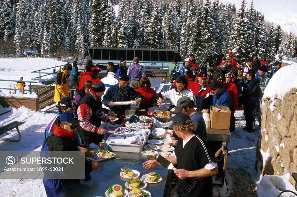 Colorado. Crested Butte. Group Eating Lunch At Paradise Warming House.
