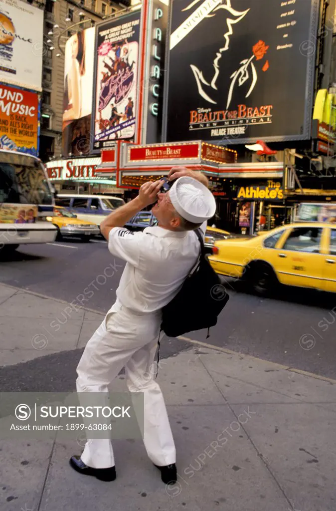 New York City, Times Square. Sailor Taking A Picture.