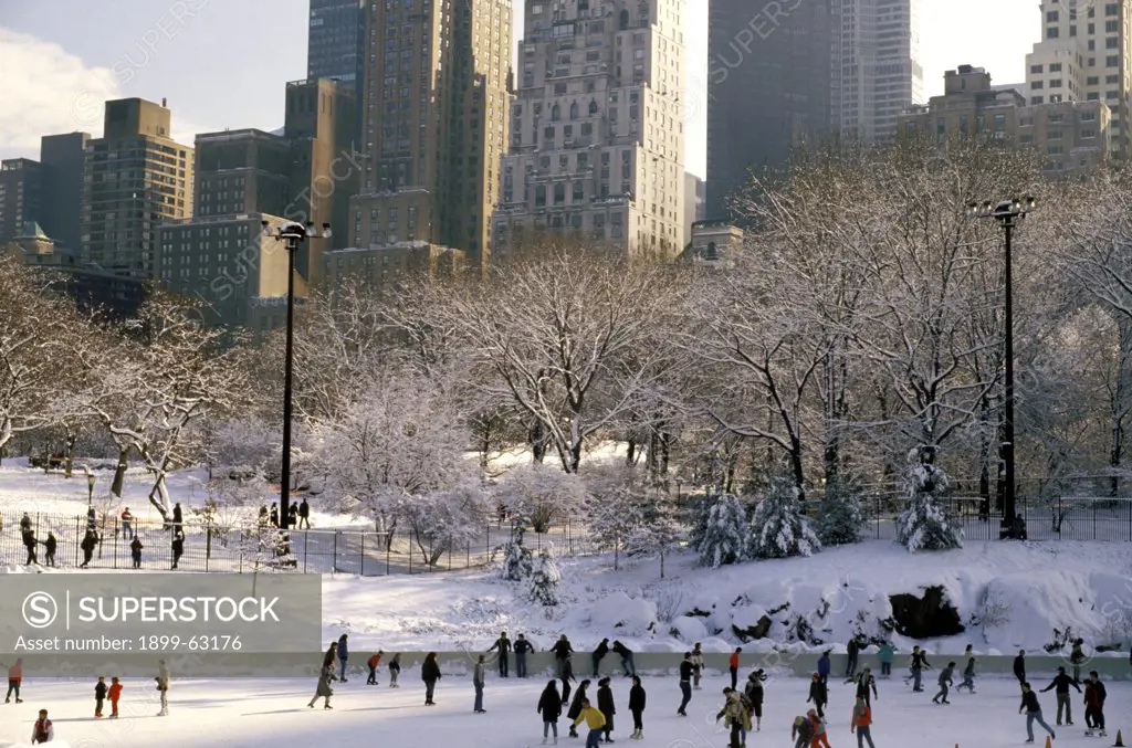 New York City, Central Park. Ice Skaters In Wollman Rink, After Snow Storm