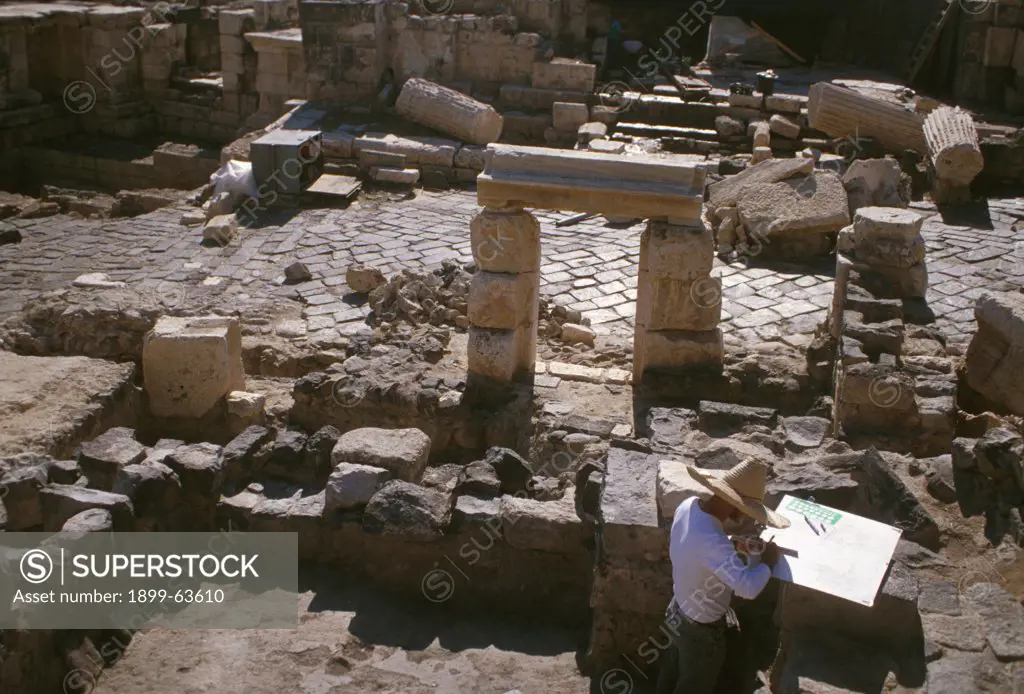 Israel, Beit SheAn. Archeologist Executing Site Drawings Amid Ancient Ruins