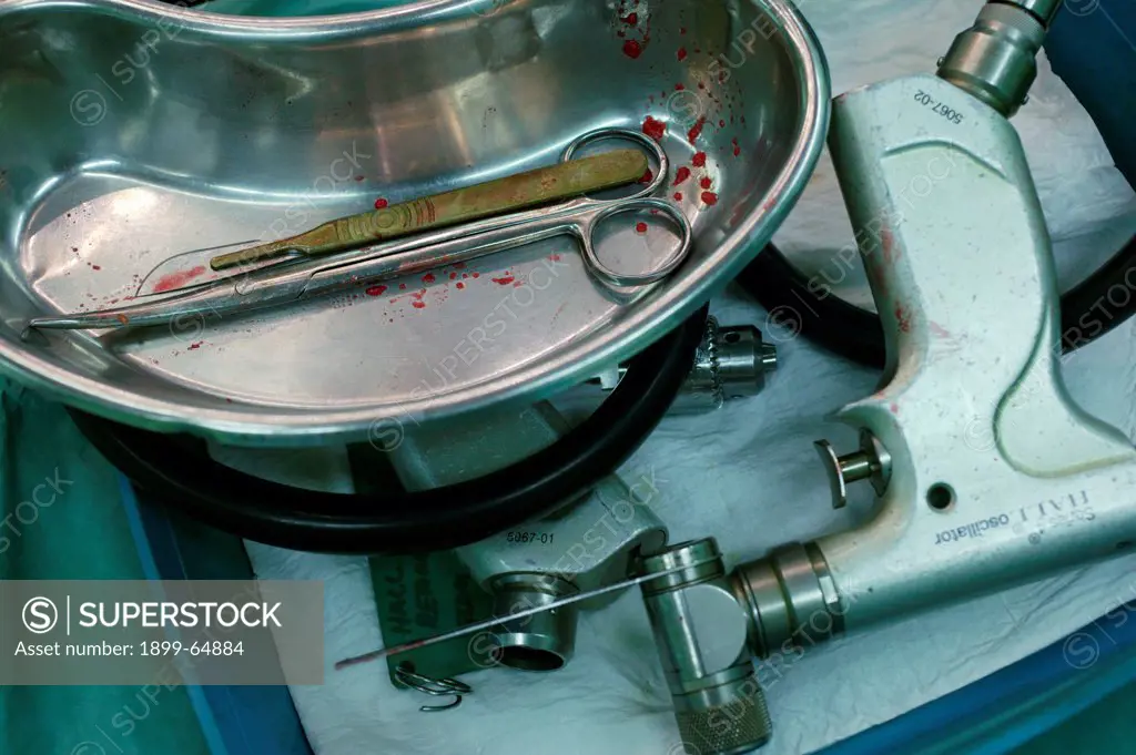 Surgical equipment in kidney dish. UK