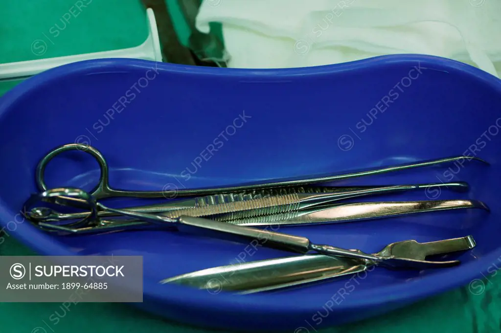 Surgical equipment in kidney dish, high angle view. UK