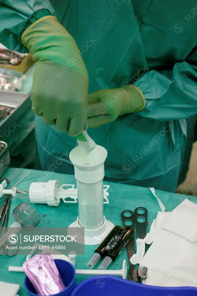 Orthopedic cement being mixed during Hemiarthroplasty,
