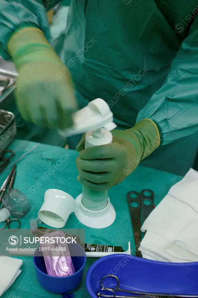 Orthopedic cement being mixed during Hemiarthroplasty,