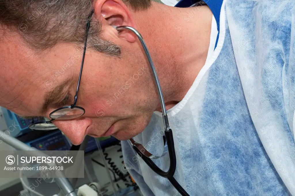 Doctor with stethoscope in his ears