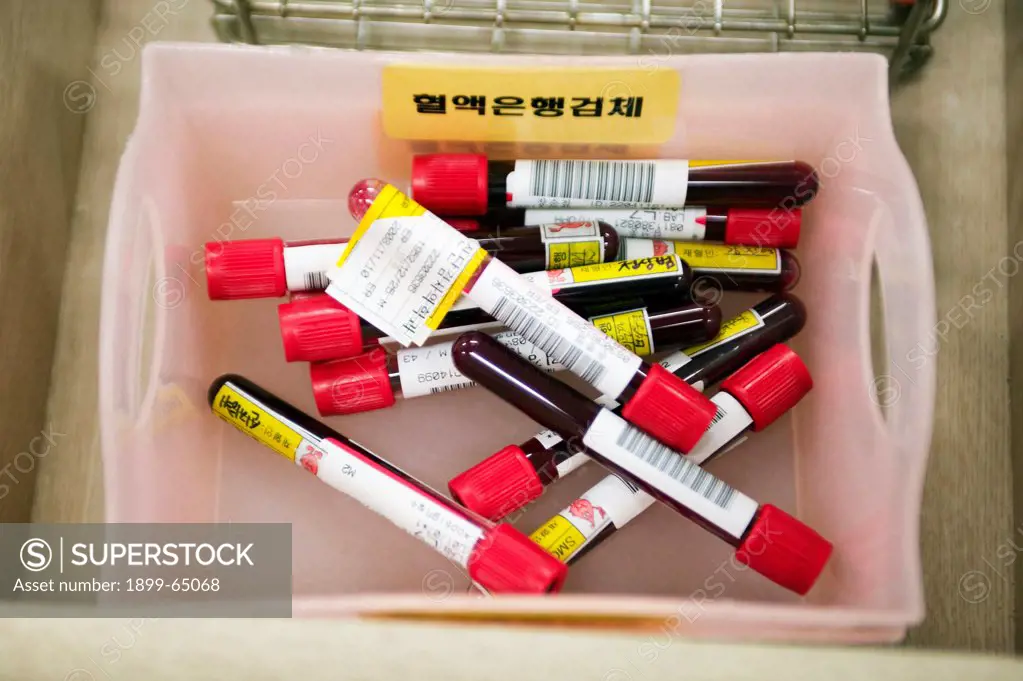 Patients blood is bottled and labeled prior to be