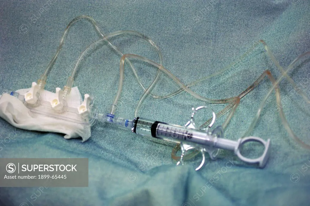 The control syringe and three-way manifold that is