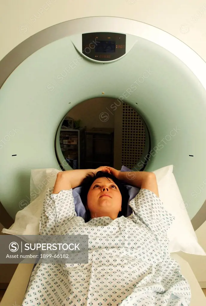 Patient on examination table of computed tomography scanner