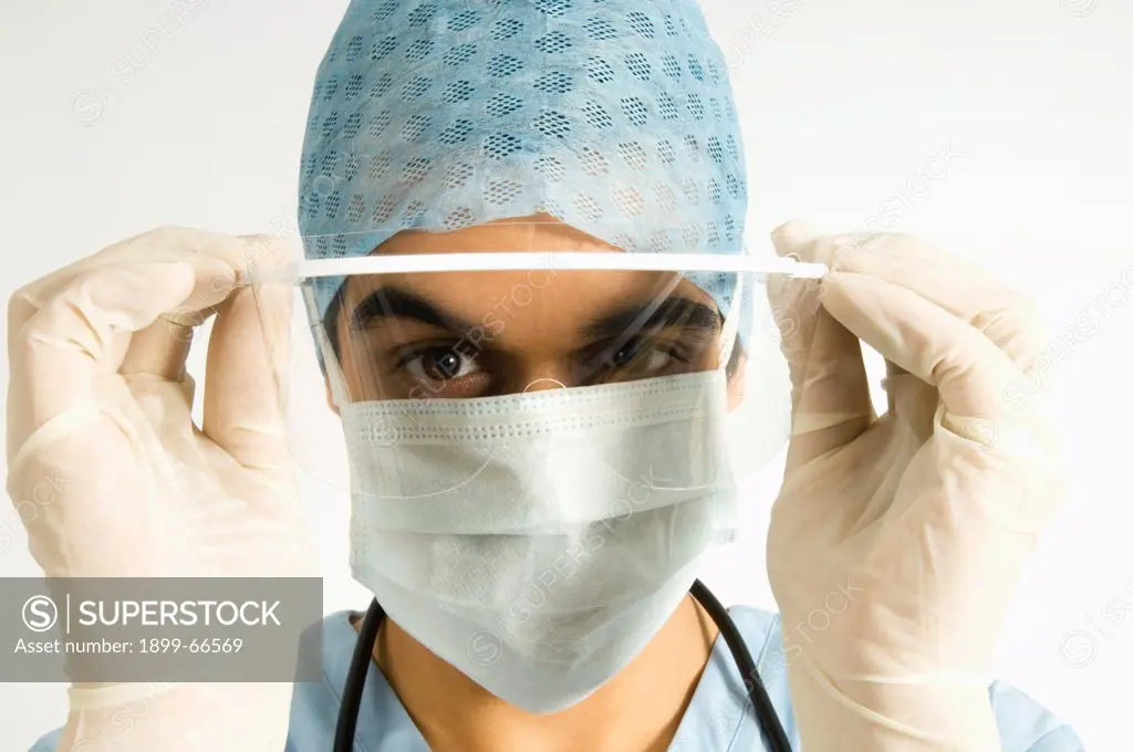 Portrait of surgeon wearing hygiene hat,