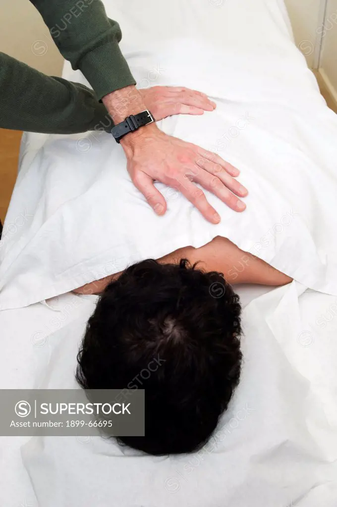 Male patient undergoing acupuncture