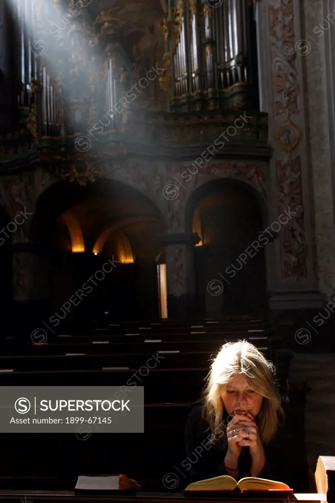 The  baroque church of the abbey of Herzogenburg.  Woman reading the bible.