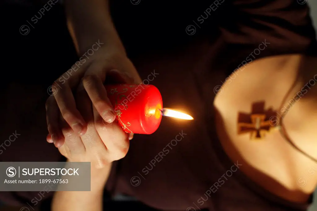 Girl holding a Christmas candle