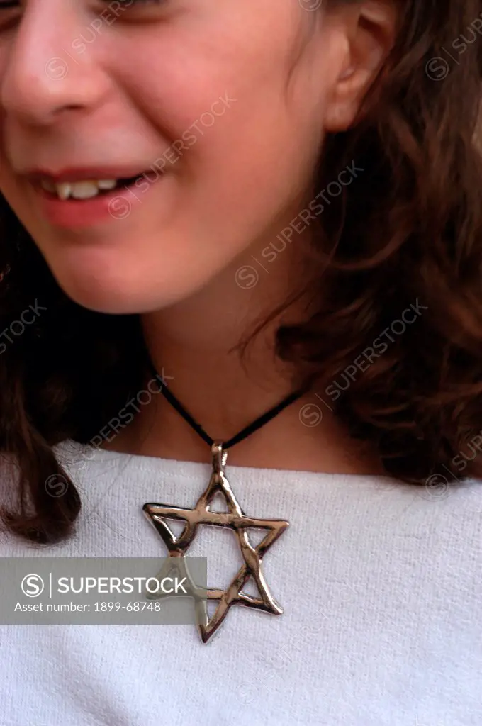 Jewish girl wearing star of David jewelry