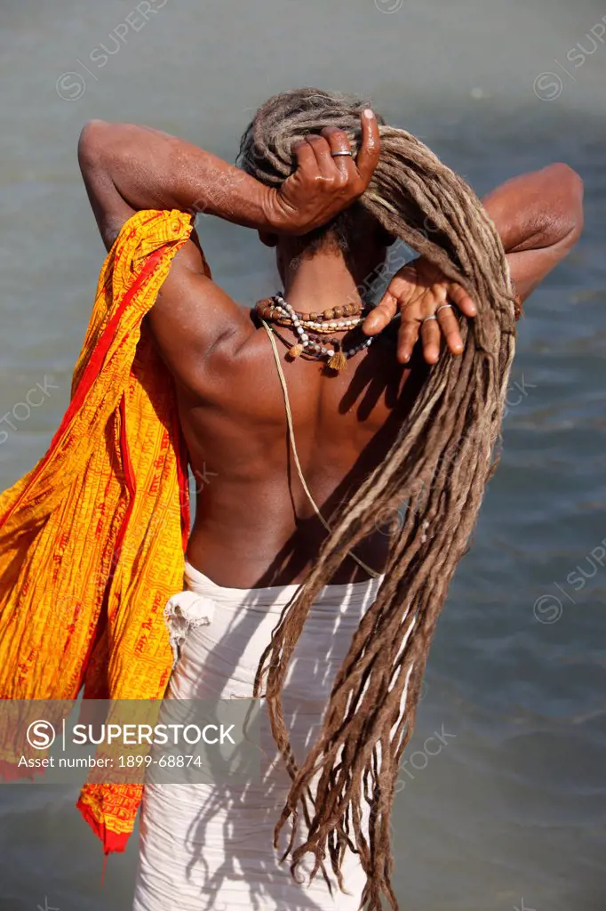 Sadhu preparing for a dip in the Ganges