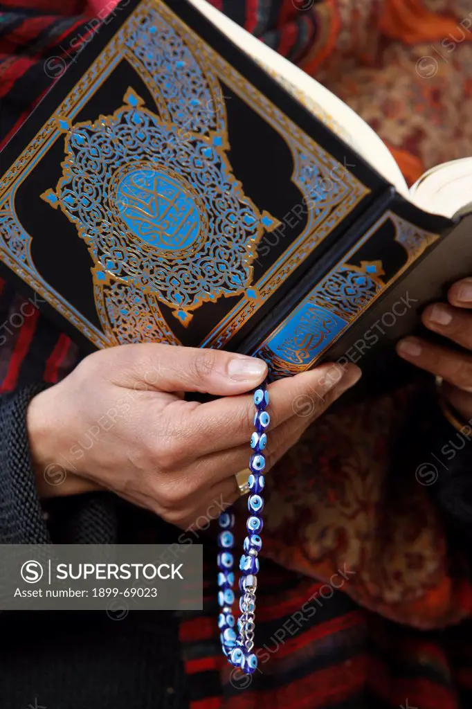 Woman reading Kuran