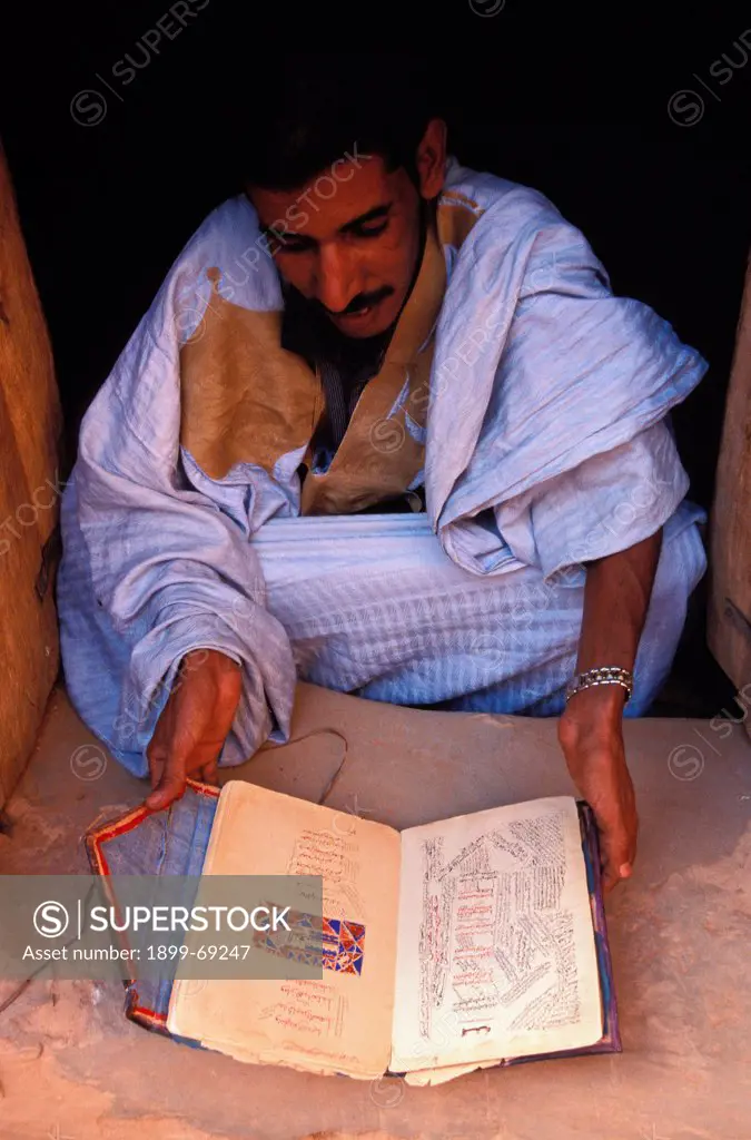 Member of Ehel Hamoni family showing old koranic manuscripts