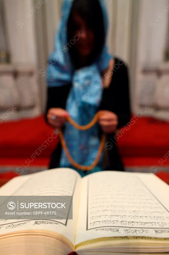 Woman praying in a mosque