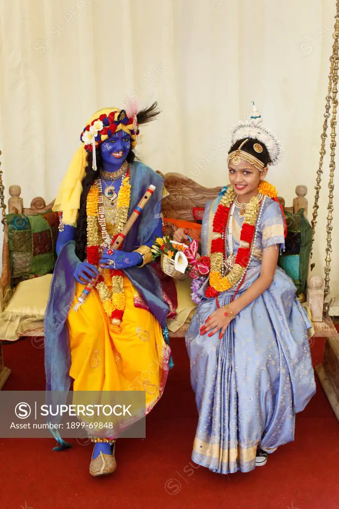 Couple impersonating Hindu gods Krishna & Radha at Janmashtami festival at Bhaktivedanta Manor ISKCON (Hare Krishna) temple