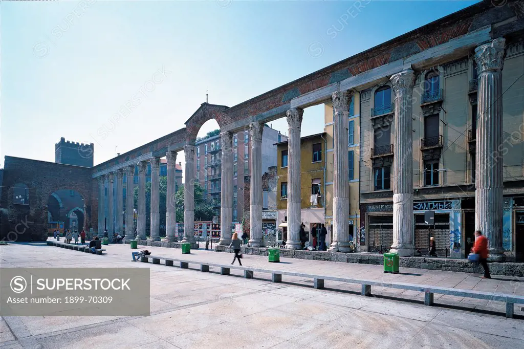 Italy, Lombardy, Milan. Detail. An external view of the Basilica, with the square and the impressive colonnade, known as San Lorenzo colonnade, on Porta Ticinese main street.