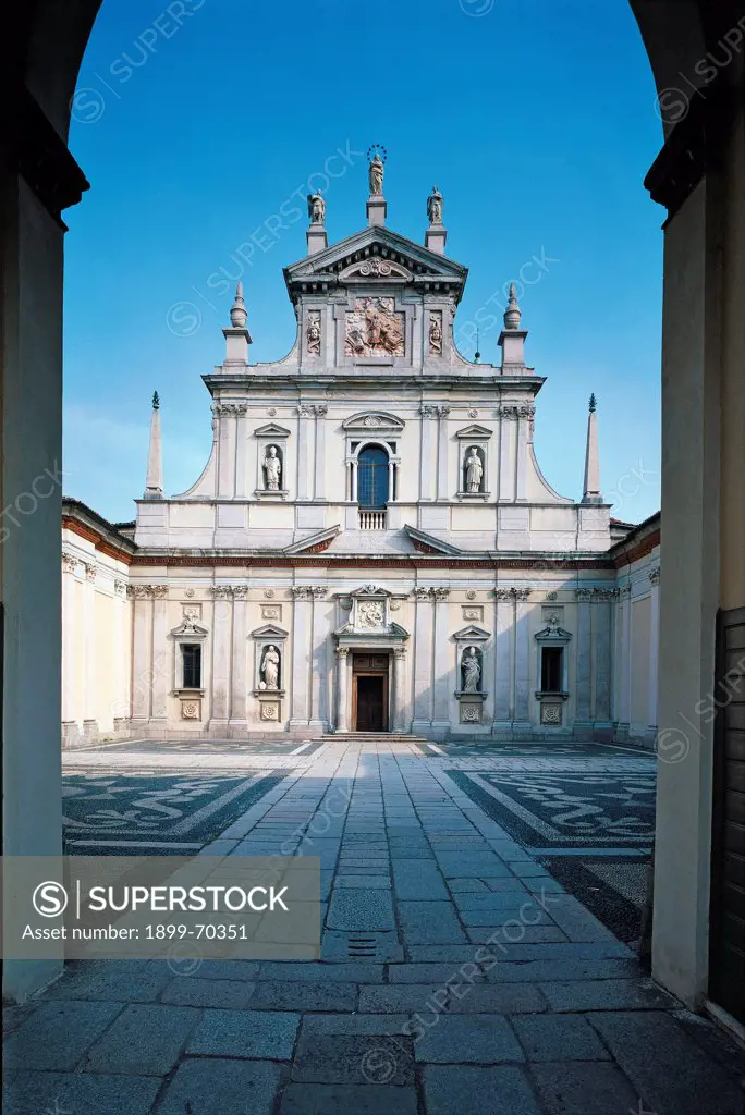 Italy, Lombardy, Milan, Carthusian monastery of Garegnano. View of the outside of the church showing the façade, the portal, the windows, the frame, the split tympanum coping, the Corinthian pilaster strips, the niches containing statues, the pinnacles and the acroteria.