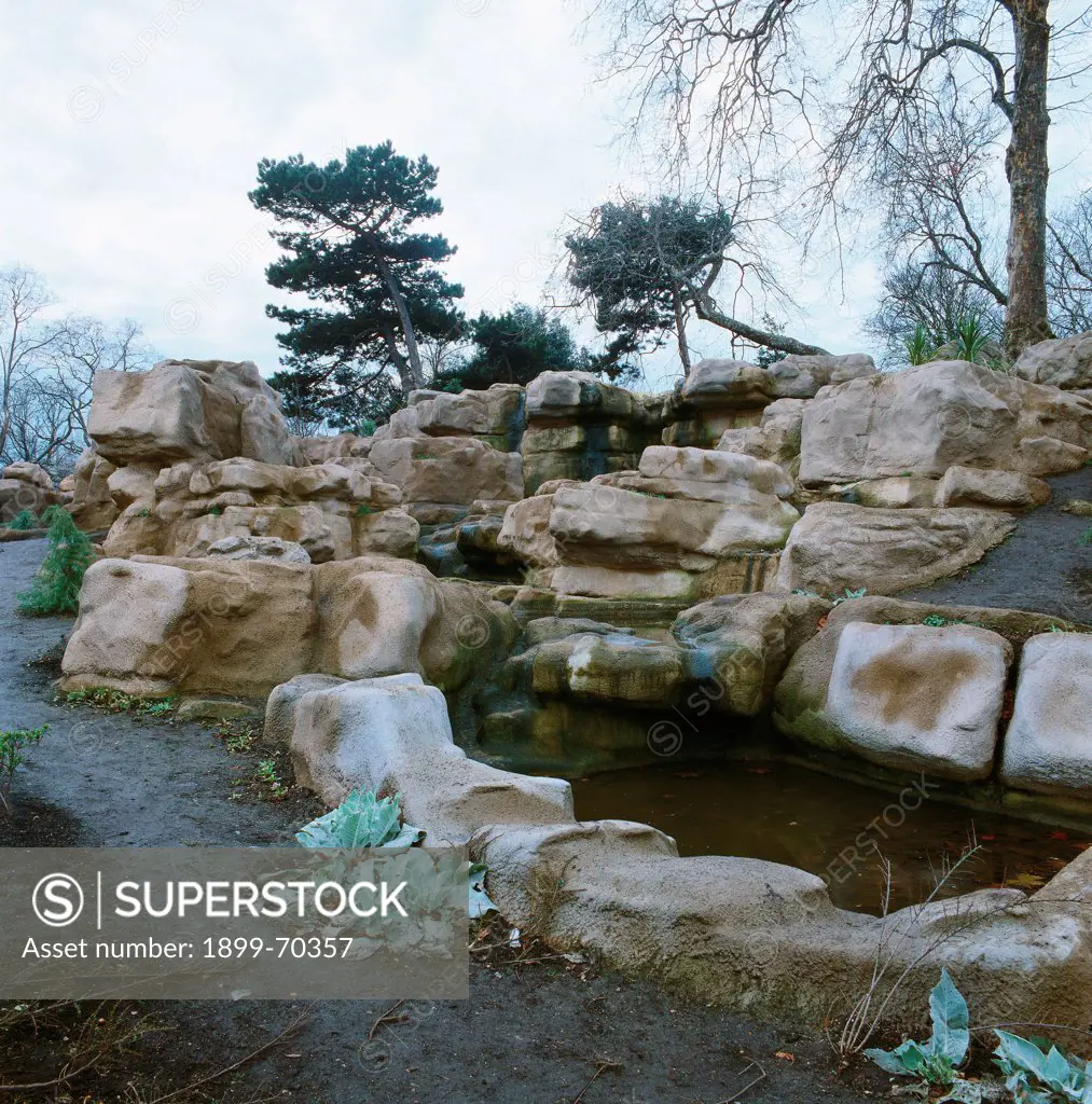 United Kingdom, London, Battersea Park. Detail. View of the park with rocks, trees and plants.
