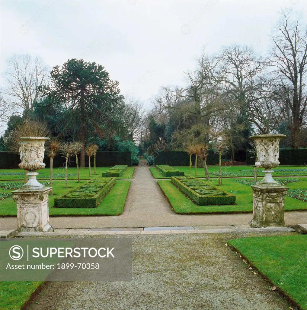 United Kingdom, London. Whole artwork view. View of the Italian garden with paths and vases.