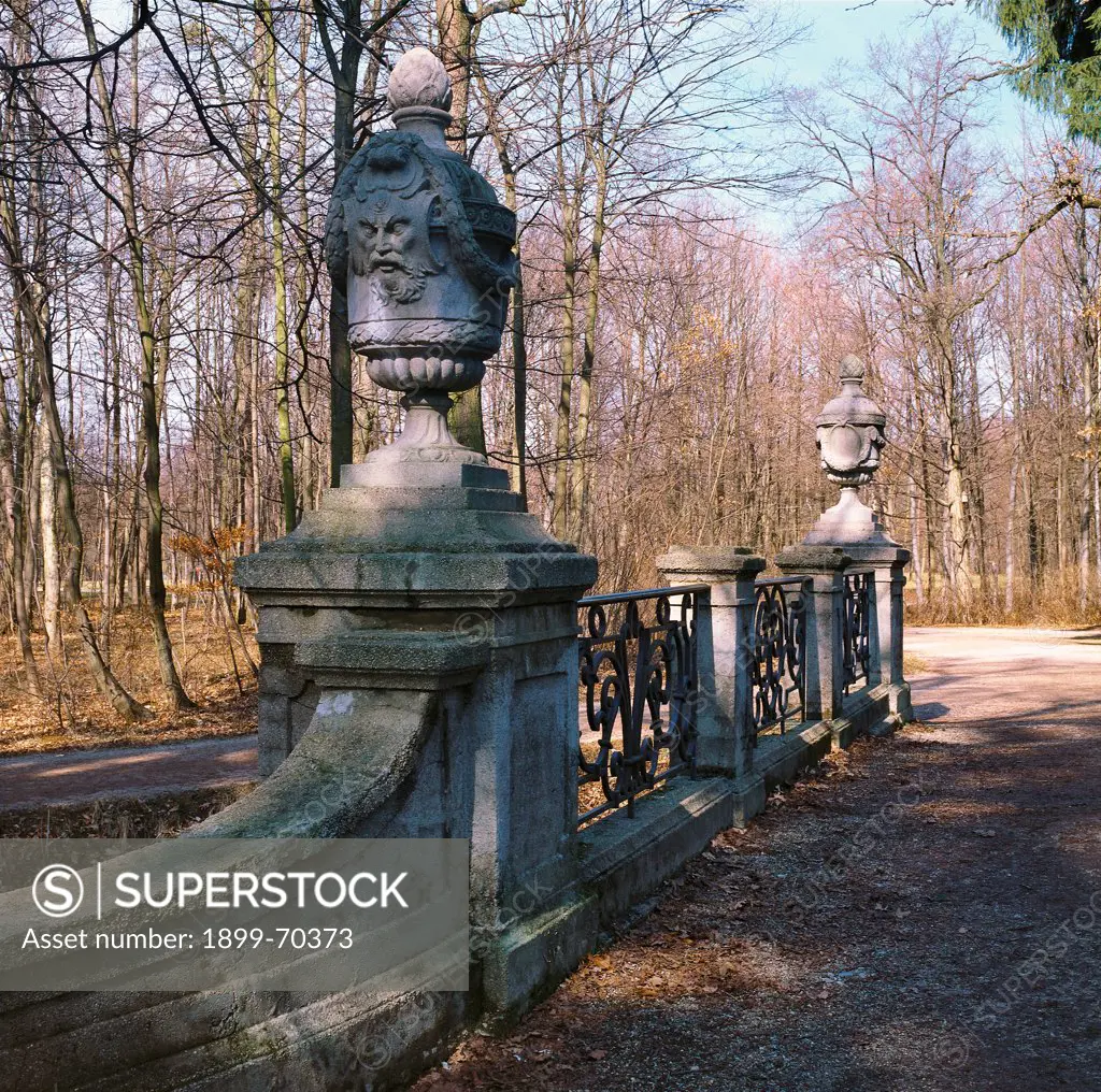 Germany, Munich, Nymphenburg Park. Detail. View of a bridge with parapet and vase-shaped sculptures.