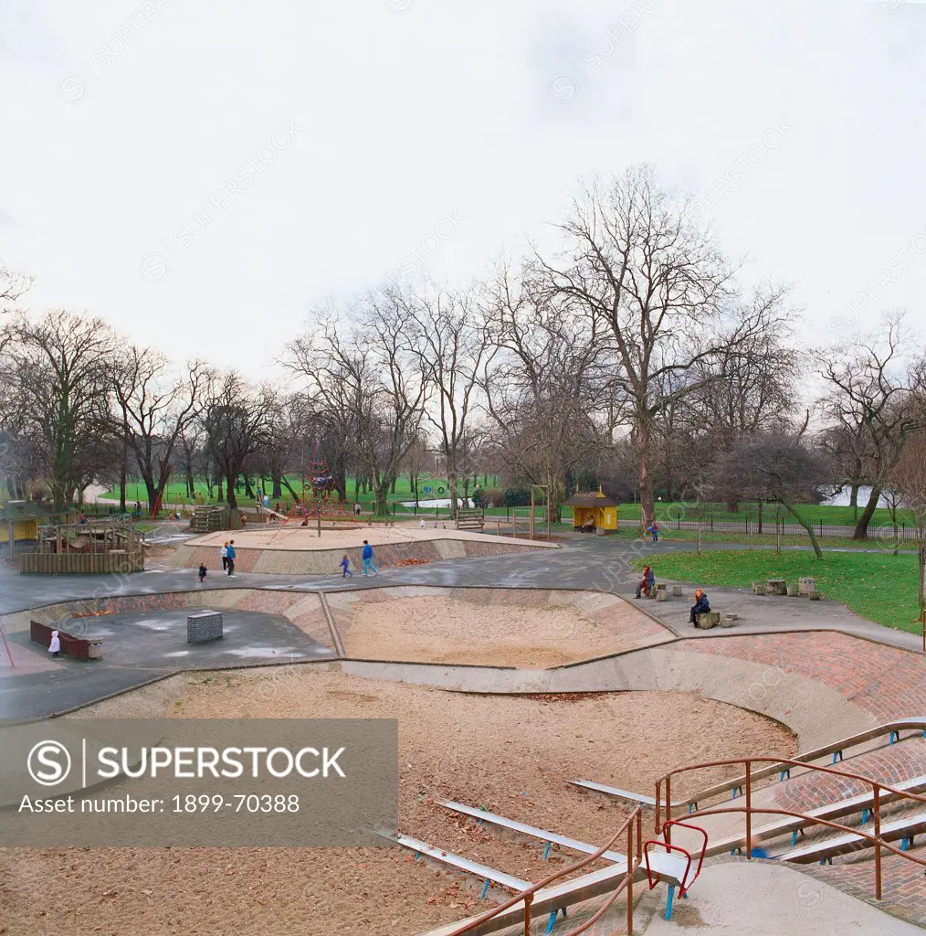 United Kingdom, London, Victoria Park. View of the playground of the garden with trees and water.