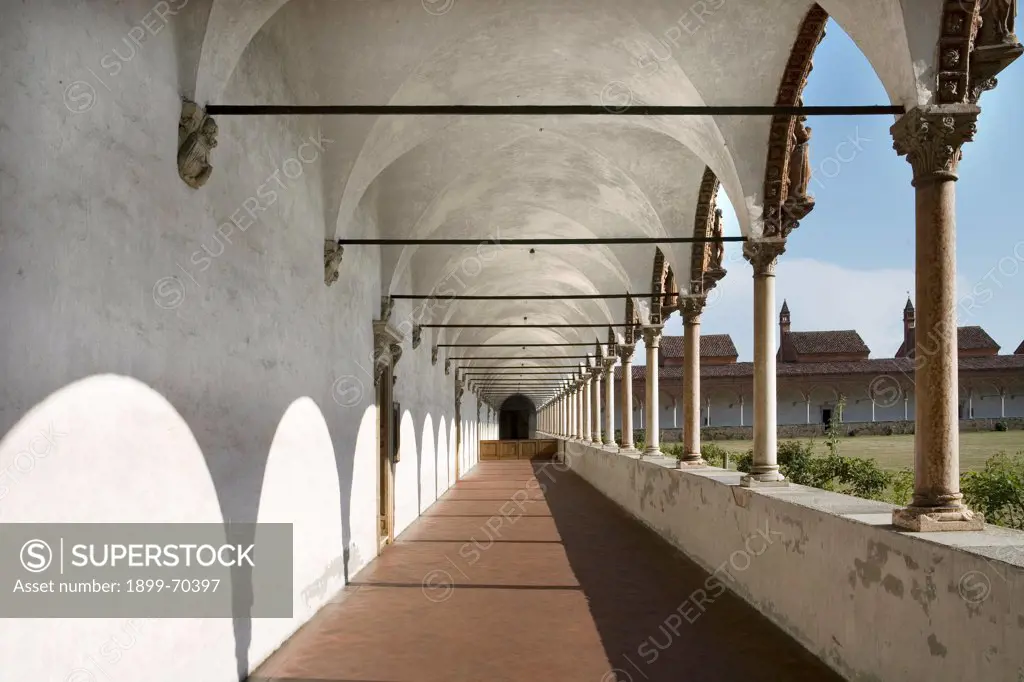 Italy, Lombardy, Pavia, Carthusian monastery. Detail. View of an arcade in the grand cloister. The columns present terracotta and marble decorations.