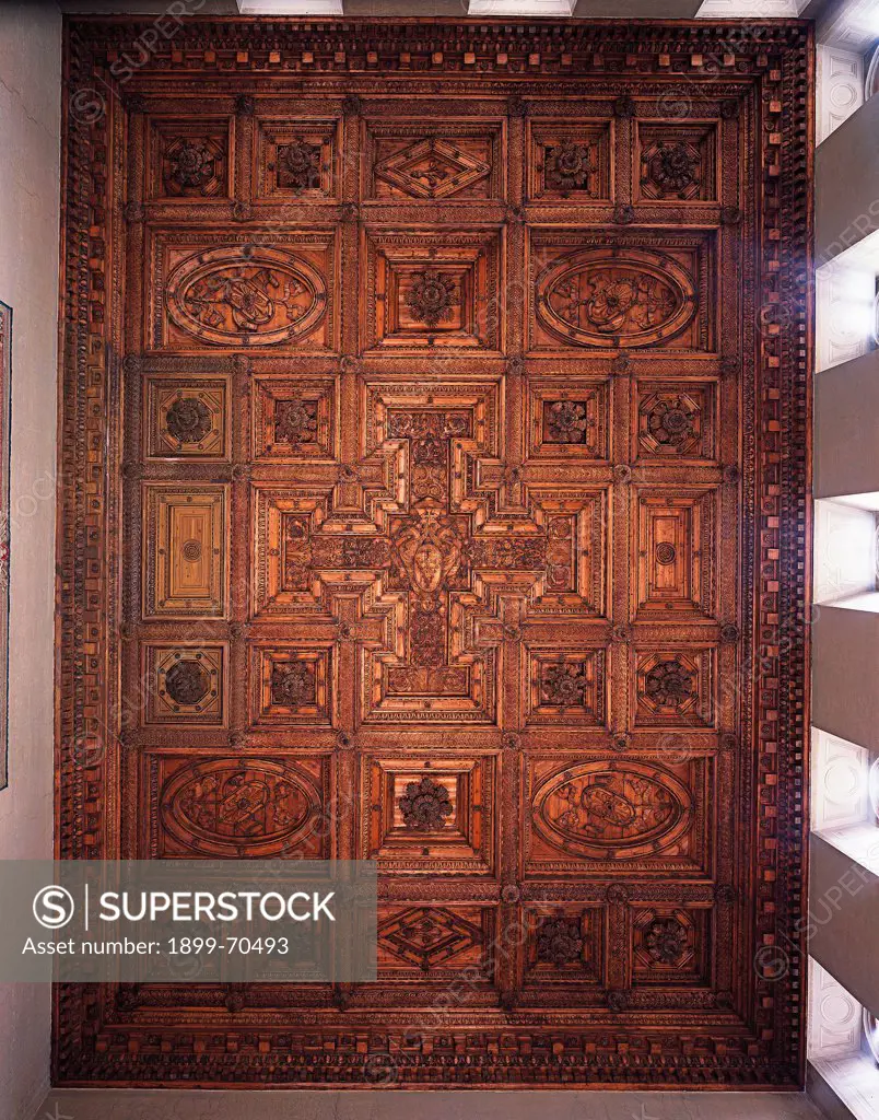Italy, Lazio, Rome (Rome), Villa Farnese. Whole artwork view. Front view of the coffered ceiling with a 'tau' cross in the centre that presents Ranuccio farnese's coat of arms. All around panels articulated in simple geometrical forms.