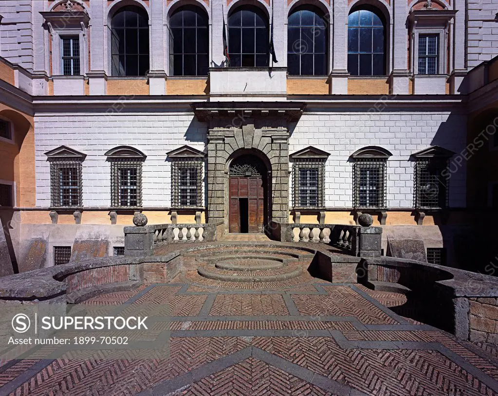 Italy, Lazio, Caprarola (Viterbo), Villa Farnese. Detail. Front view of the entrance of the facade; there is smooth rustication on the low ground; on the main floor a loggia on arcades.