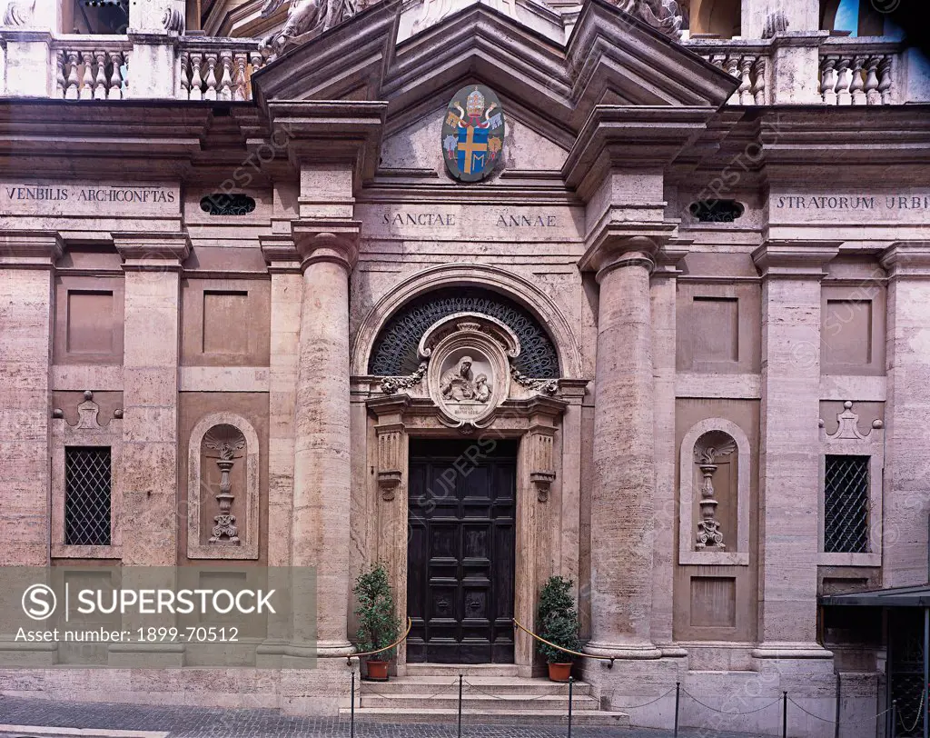 Italy, Lazio, Rome, Saint Anne in Vatican. Detail. Front view of the lower part of the facade marked by four pillars and two Tuscan columns that support the architrave and a little interrupted pediment.