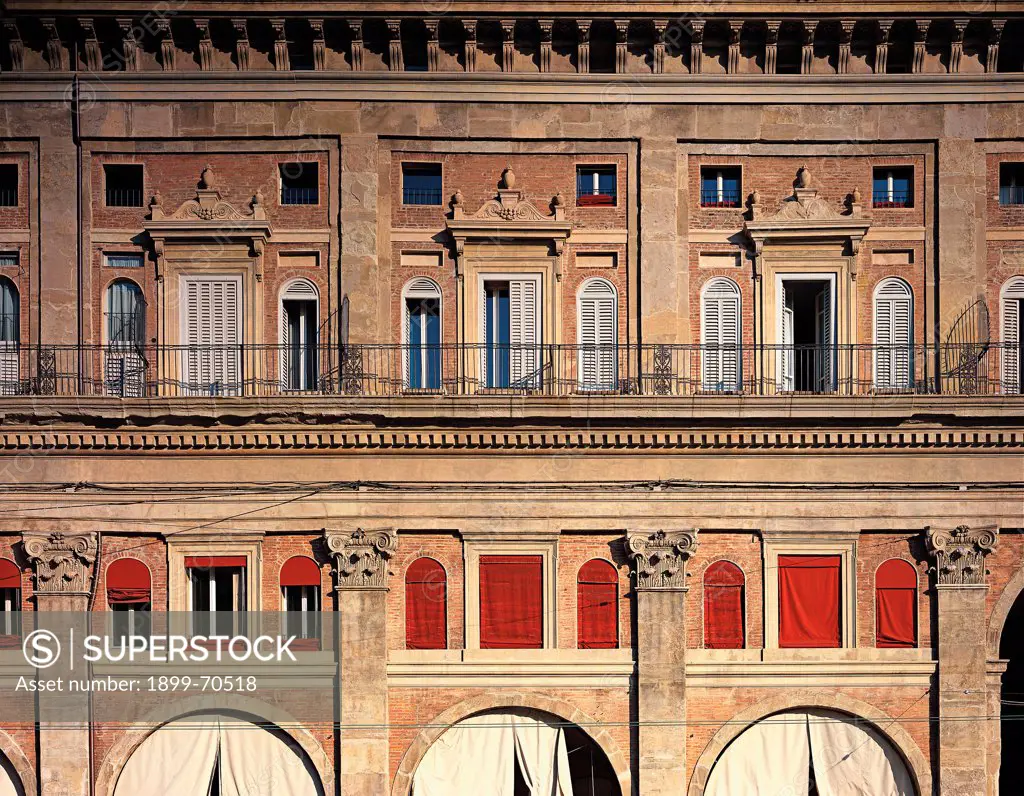 Italy, Emilia-Romagna, Bologna, Palazzo dei Banchi. Detail. Front view of the facade that presents the first order with composite giant pilasters supporting a string course cornice. On the upper floor there are windows with volute tympanums on corbels.