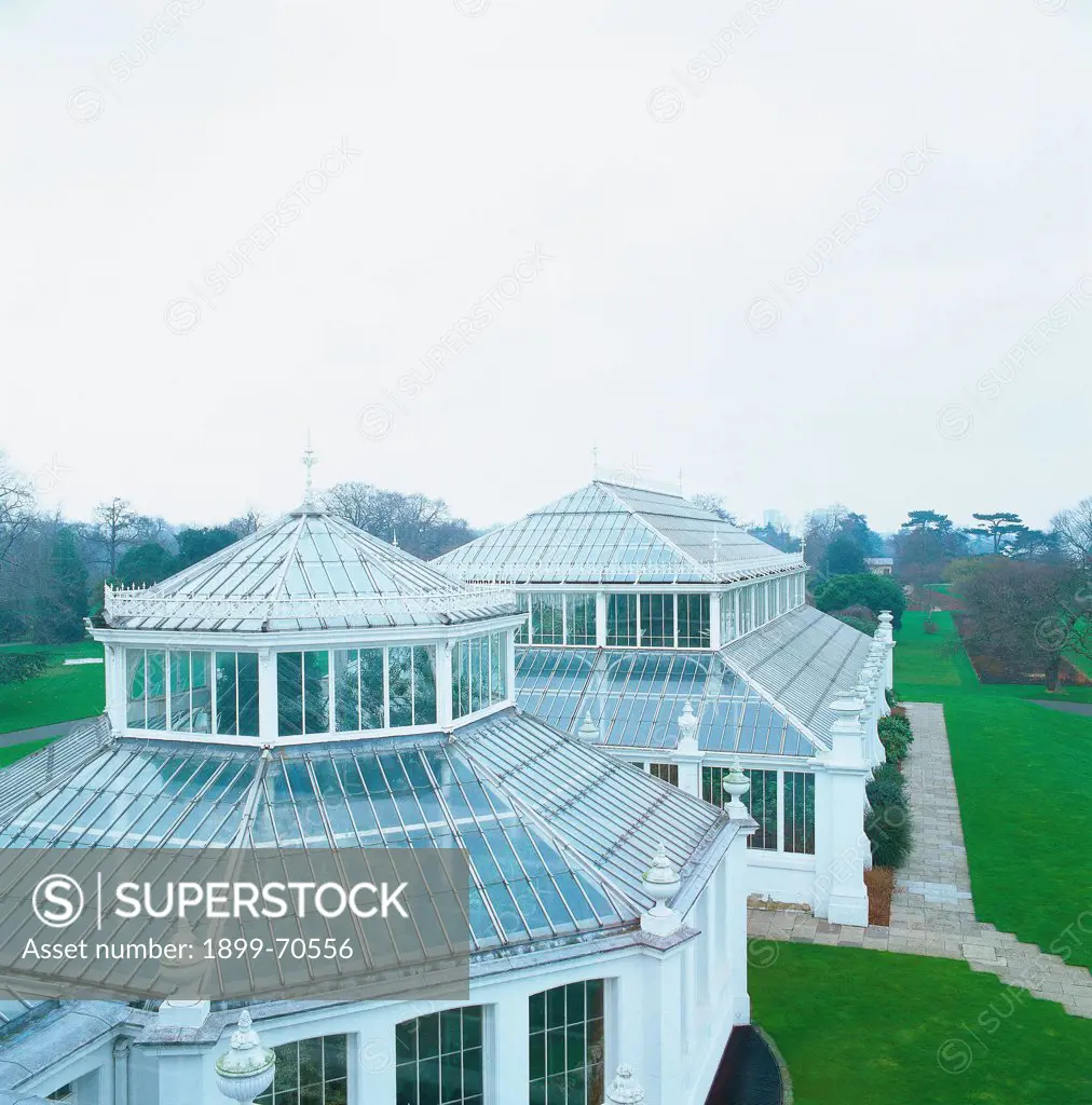 United Kingdom, London, Kew Gardens. Detail. External view of the Temperate House. Foreshortening view of the glass houses covered with domes made of iron and glass.