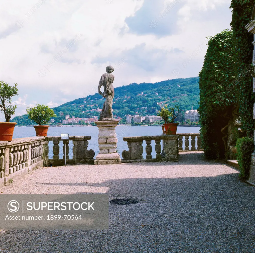 Italy, Lombardy, Isola Bella, Borromeo Gardens. Detail. View towards Lake Maggiore. A parterre marked with balustrades and a statue.