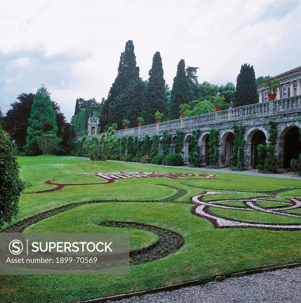 Italy, Lombardy, Isola Bella, Borromeo Gardens. Detail. Foreshortening view of the parterre in front of the Villa Borromeo terraces. The flowers in the flowerbed draw three rings, which are one of the araldic symbols of the Borromeo family.