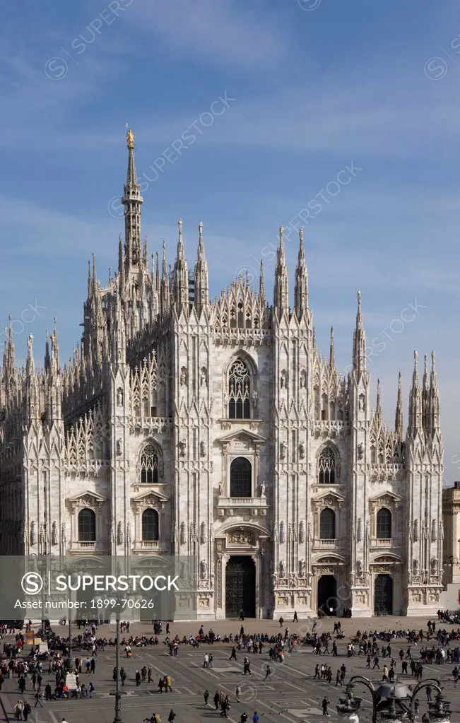 Italy, Lombardy, Milan, Duomo. Whole artwork view. The gabled roof facade of the cathedral.