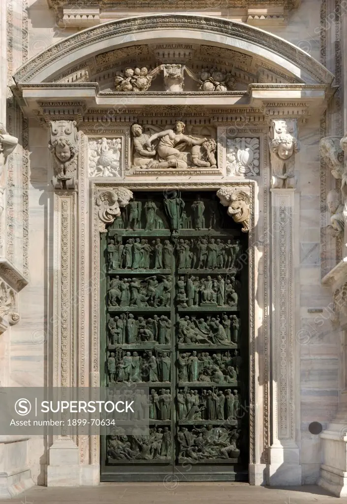 Italy, Lombardy, Milan, Duomo, Second portal from left. Whole artwork view. Portal with scenes from the life of Saint Ambrose.