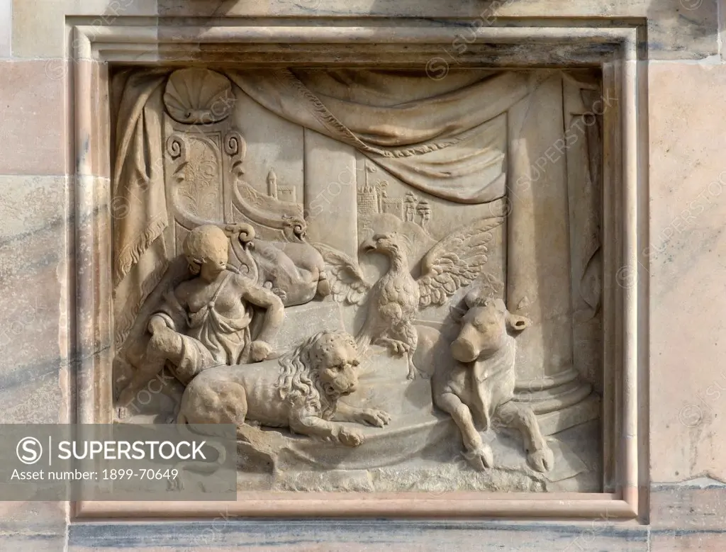 Italy, Lombardy, Milan, Duomo, Facade. Detail. The symbols of the Evangelists: an angel, a lion, an eagle and a bull.