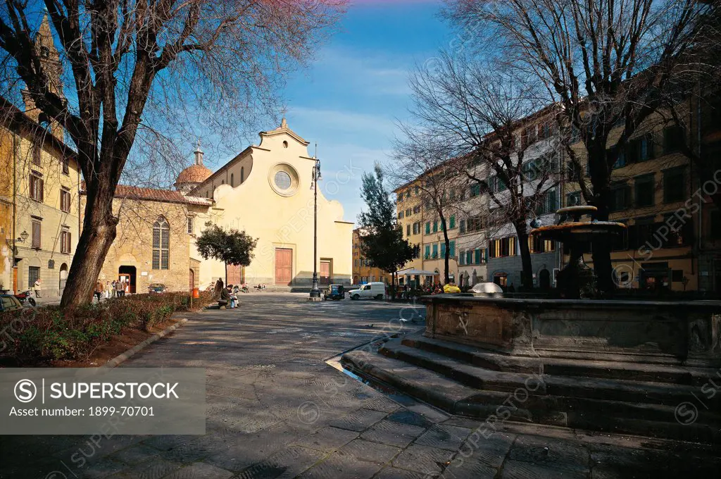 Italy, Tuscany, Florence, Santo Spirito Square. Whole artework view. View of Santo Spirito Square. In the background the facade of the Church of the Holy Spirit, on the right a fountain.