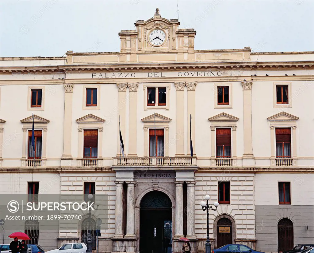 Italy, Basilicata, Potenza, Mario Pagano Square. Whole artwork view. Front view of the neoclassical facade marked by pilasters with Corinthian capitals that frame the windows surmounted by triangular pediments. The facade ends with a gable decorated with the clock. Near the portal an ashlar covering.