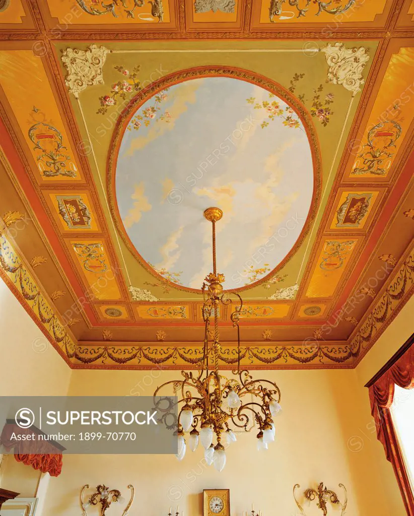 Italy, Liguria, Imperia, Prefecture Palace. Detail. A foreshortening view of the ceiling of one of the rooms of the palace frescoed with a blue sky.