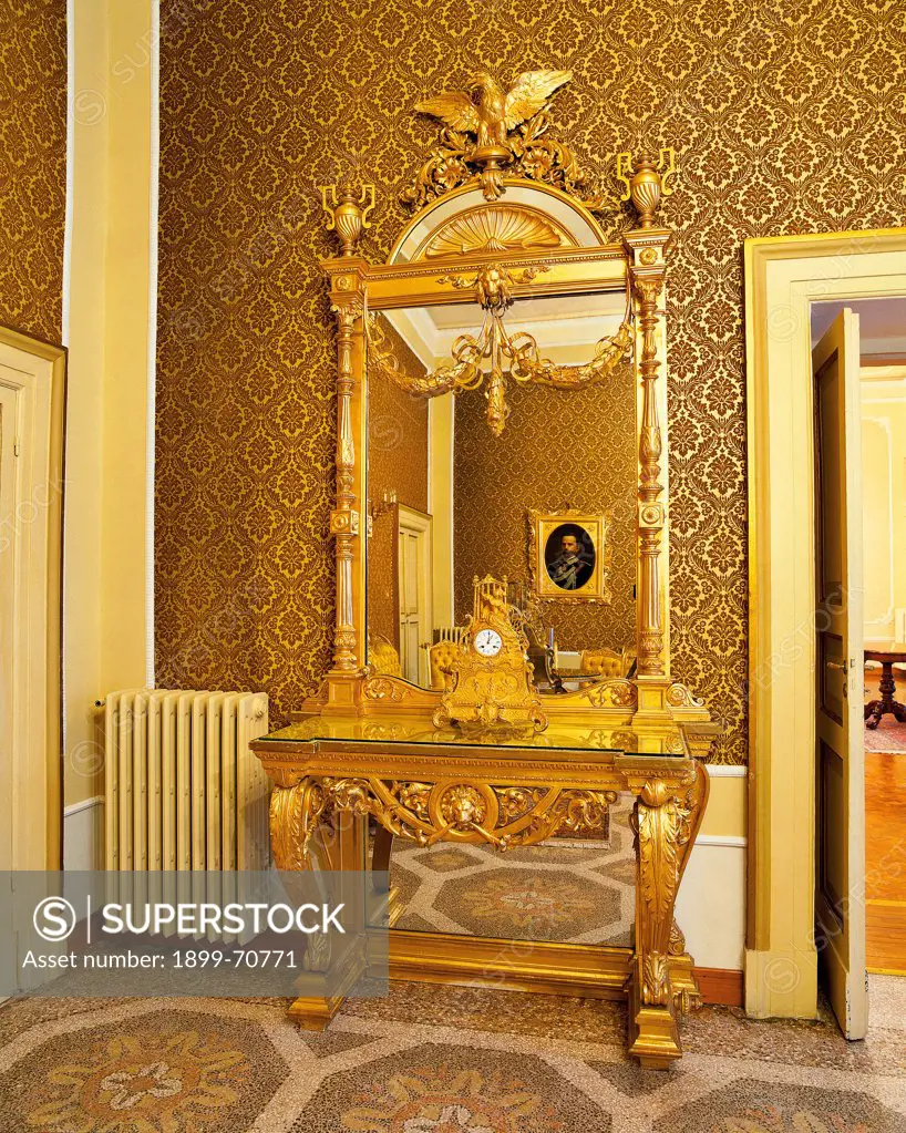 Italy, Abruzzo, L'Aquila, Prefecture Palace. Detail. A console with a mirror surmounted by an eagle, symbol of the city. The console is placed in the apartment especially built for the visit of Umberto and Margherita of Savoy.