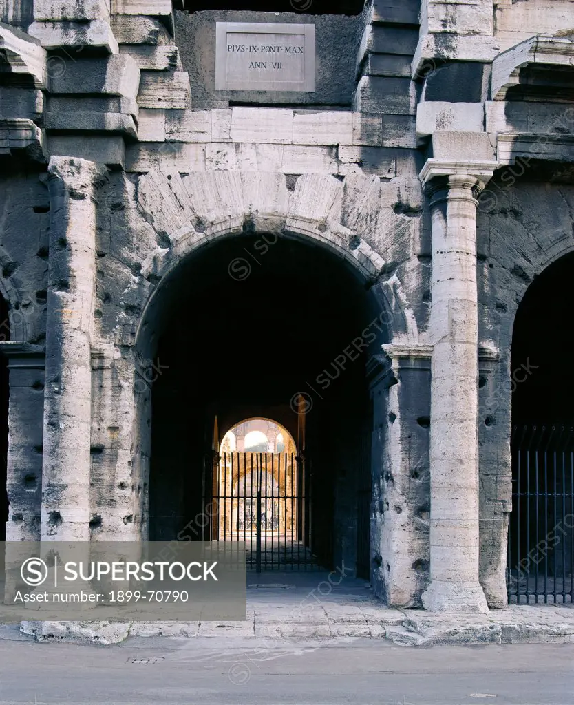 Italy, Lazio, Rome, Flavian Amphitheatre - Colosseum. Detail. An arcades on the ground floor flanked by two columns.