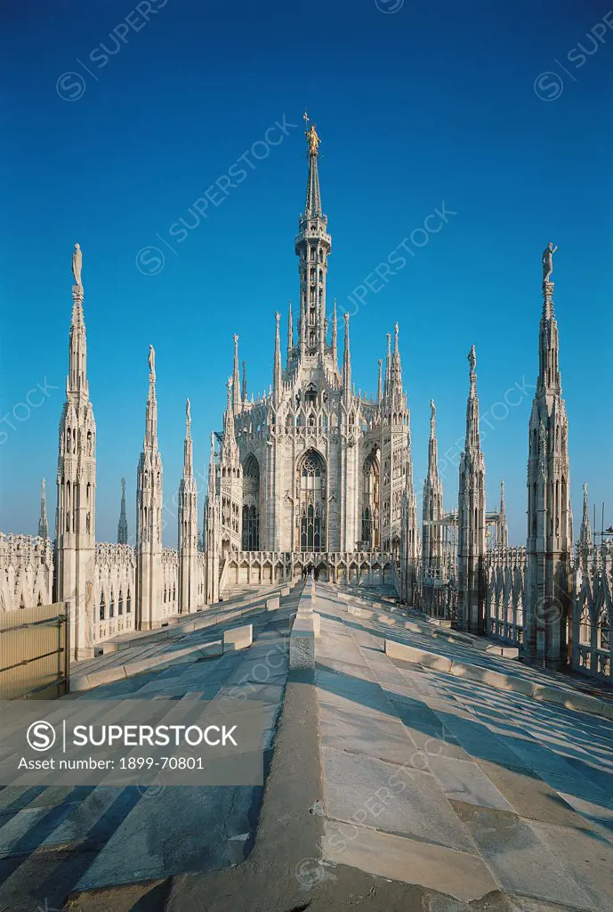 Italy, Lombardy, Milan, Duomo. Detail. Exterior of the cathedral: the roof, the spires and Francesco Croce's spire, with the Madonnina.