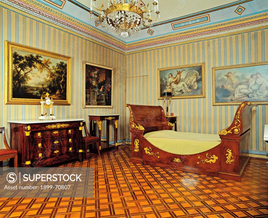 Italy, Piedmont, Chivasso, Torino, Villa Cimena. Detail. View of the bedroom with parquet, the walls host mythological paintings and landscapes; the furnishing includes a dresser in burr and a sofa.