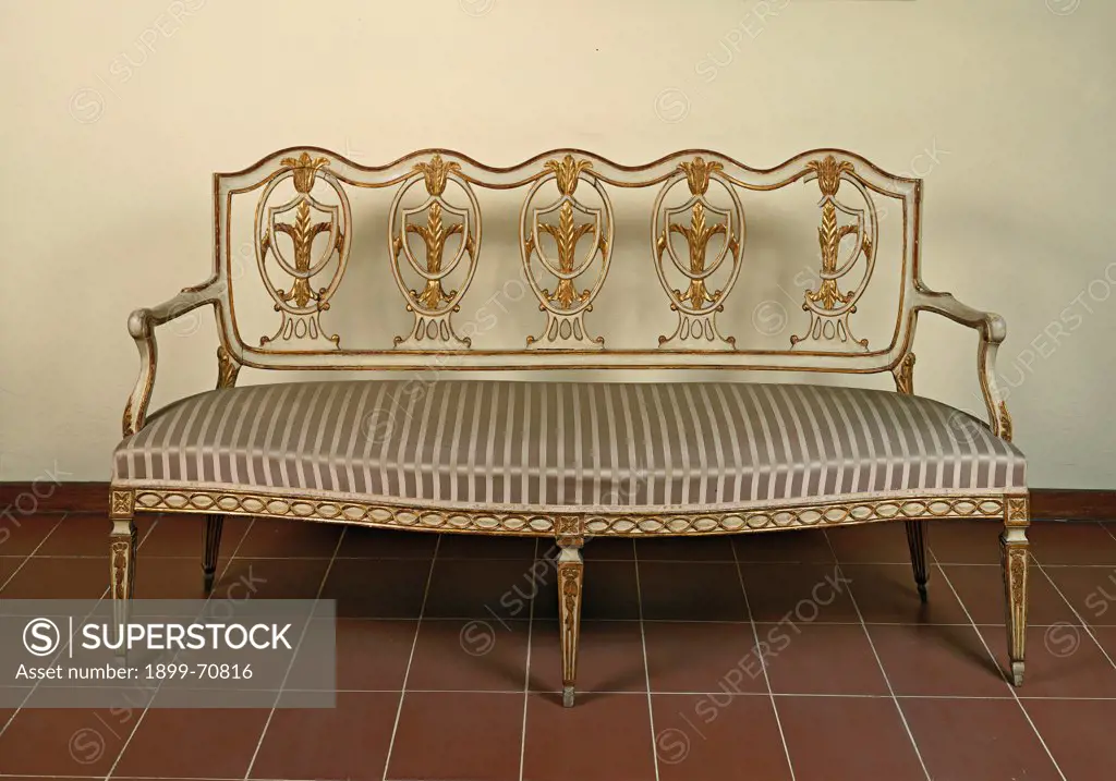 Italy, Tuscany, Florence, Superintendency of Finance (Revenue Service). Whole artwork view. A Settee in carved and gilded wood with a stripes upholstery and the backrest hosting five medallions with the lily of florence.